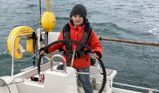 Child steering boat